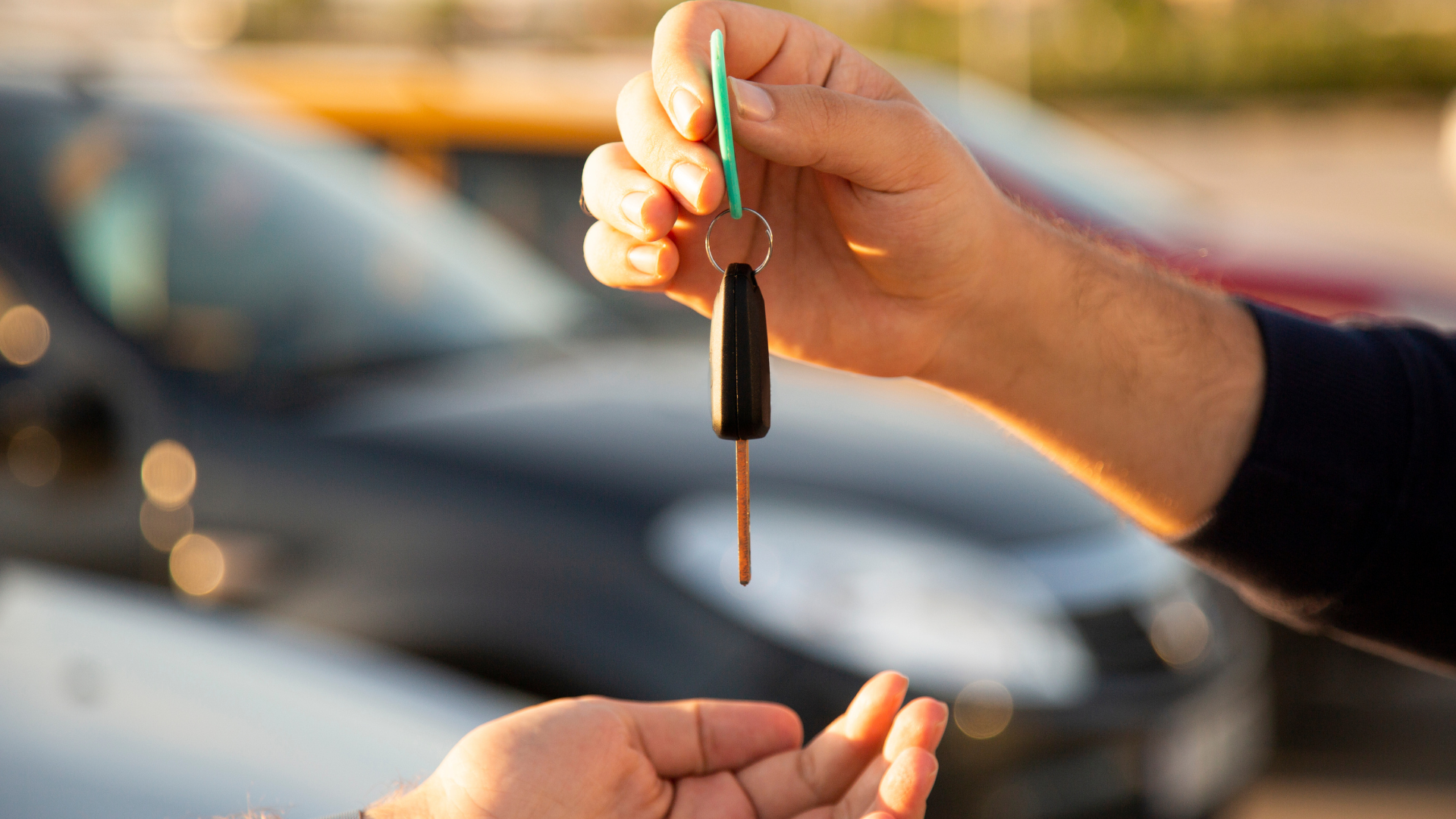handing over car keys for a second hand car sale