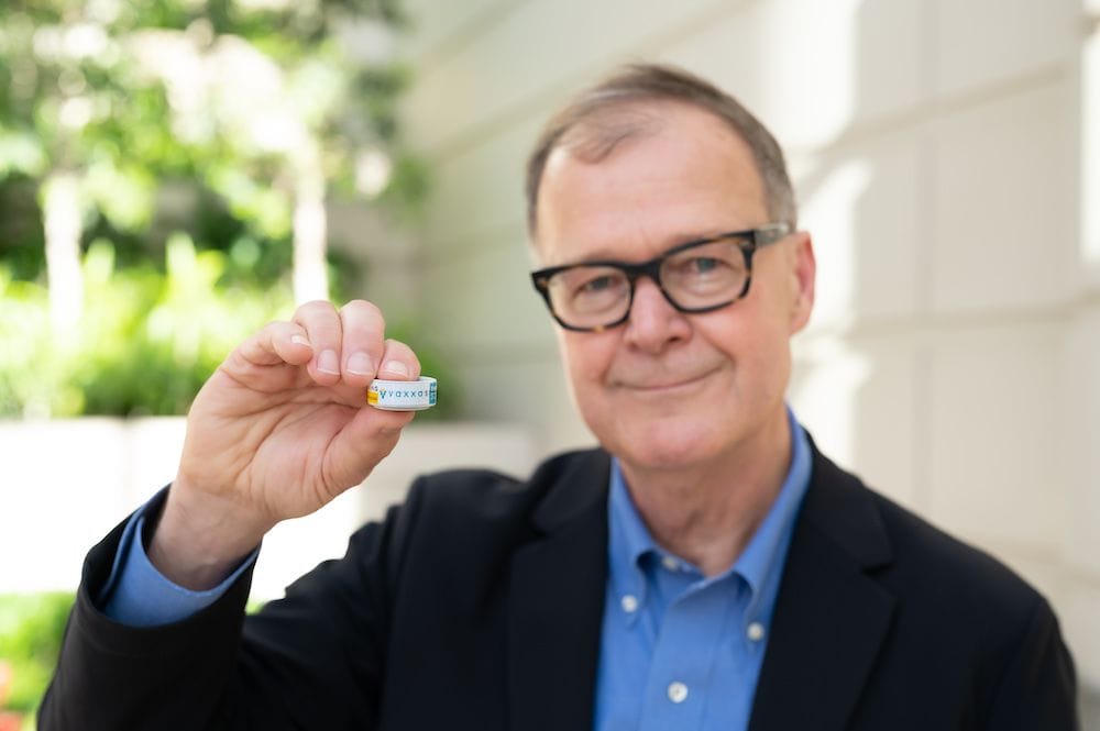 Vaxxas CEO David Hoey with the Vaxxas patch (provided).