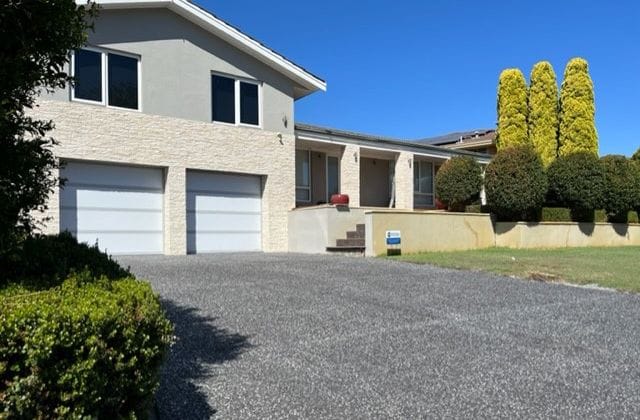 Home with new pebblecrete driveway