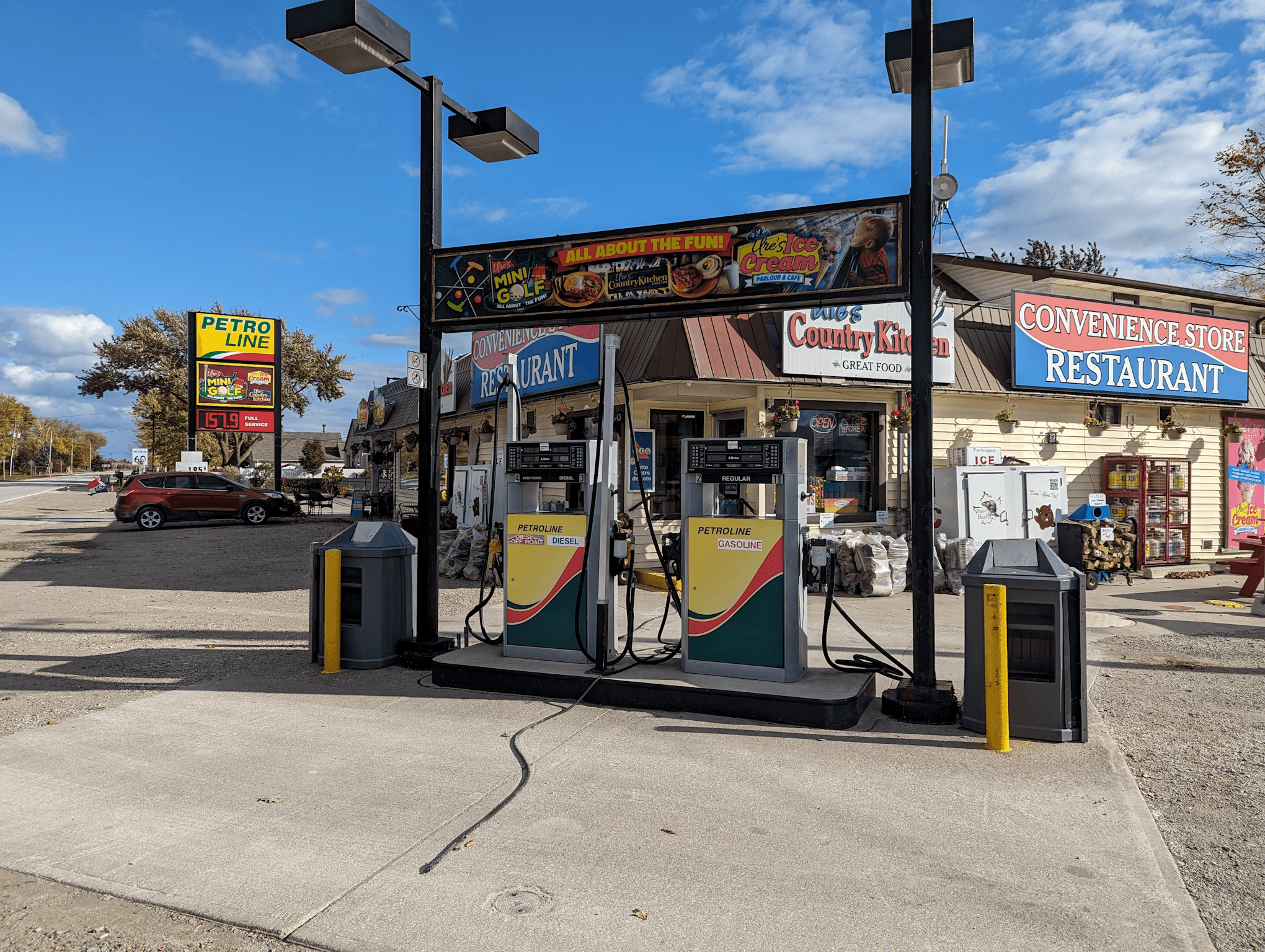 Come to Ure's Country Kitchen and Store where you can get everything you need, including gas. Here we see the fuel pump island locataed in front of the store.