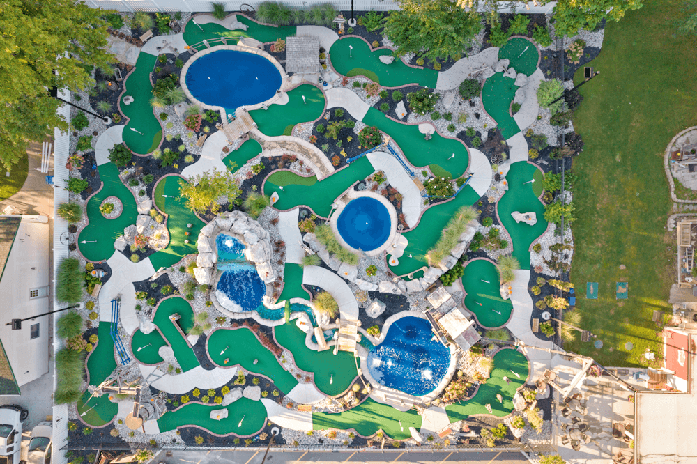 An aerial view of Ure's Mini-Golf course showing all of the highlights including winding greens, water features and much more.