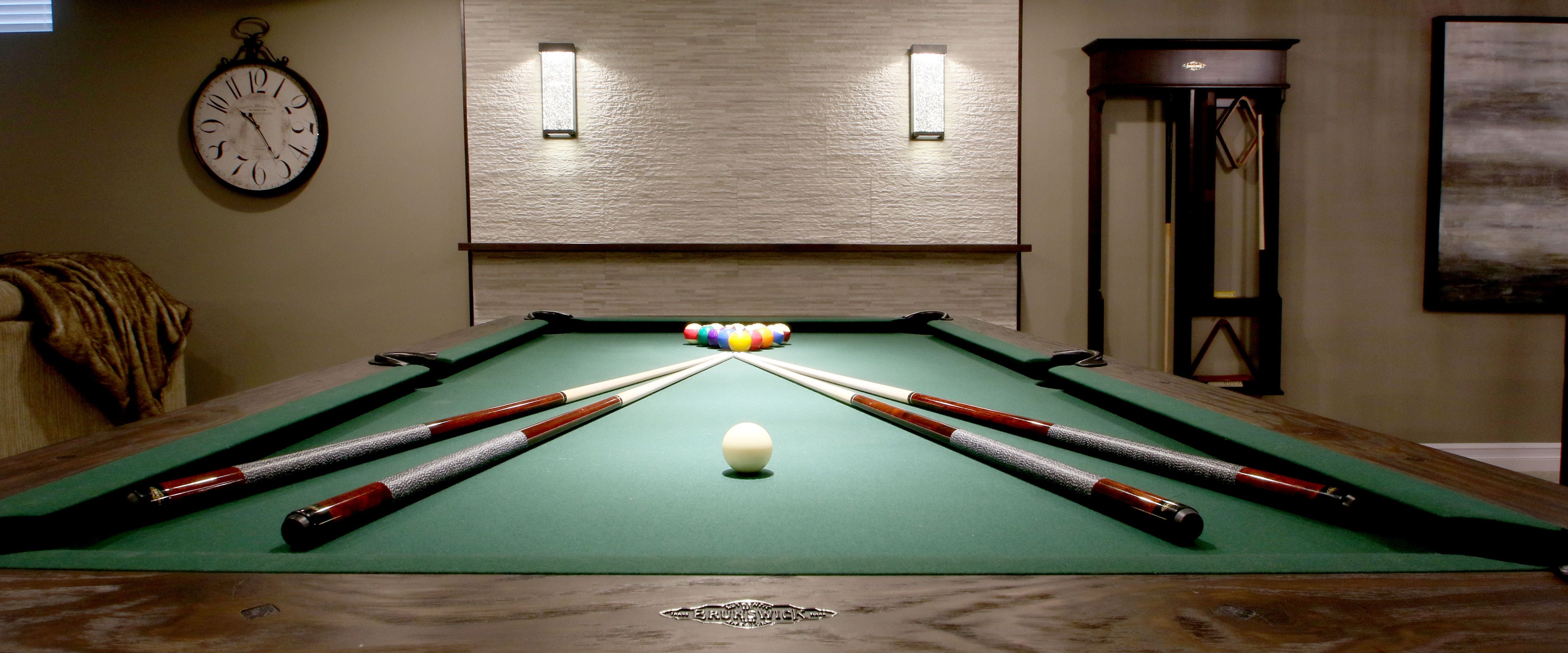 Make the most of your space for entertaining with an area for a pool table, bar and just people hanging out