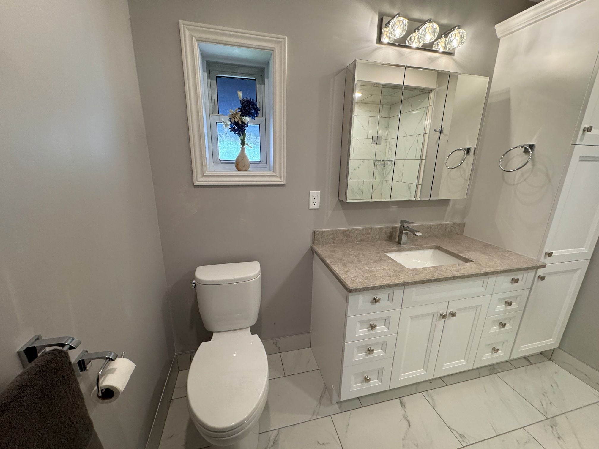 Well designed bathroom includes proper lighting, convenient placement of fixtures, and neat, clean lines