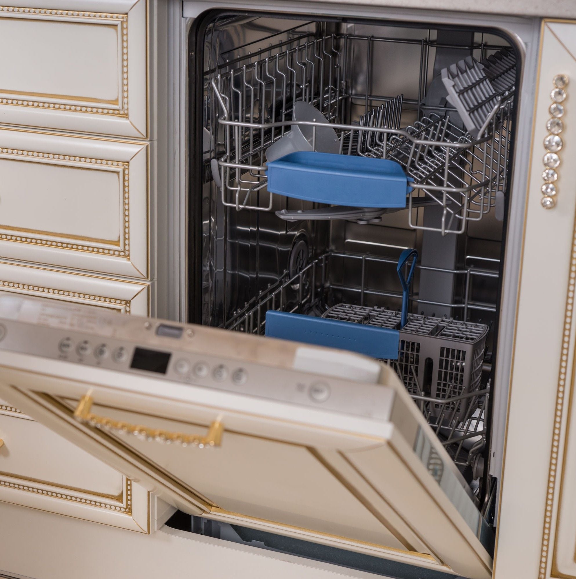 Custom cabinets designed to include a facing for the dishwasher that blends in with the surrounding cabinets