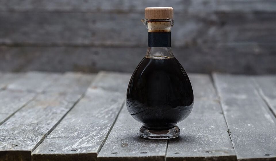 Extraction of wood vinegar from bagasse and its application as bio-reducer to produce stable silver nanoparticles with enhanced antibacterial activity