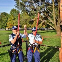 Police officers in full kit Rock Climbing