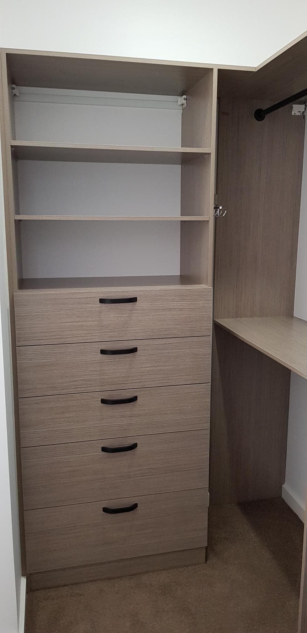 Full colour WIR using Polytec Rocco Lini Matt. No backing. Closed drawer with black handle. black hanging rod