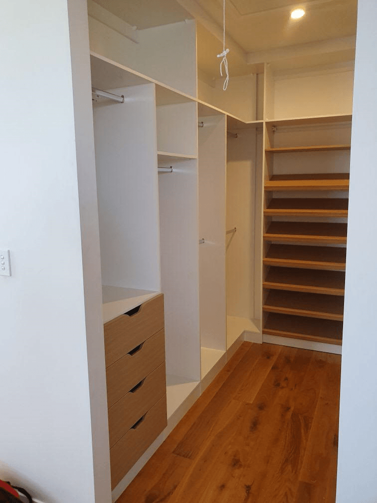 White HMR Melamine with Polytec Natural Oak matt sloping shoe shelves and scalloped drawer fronts