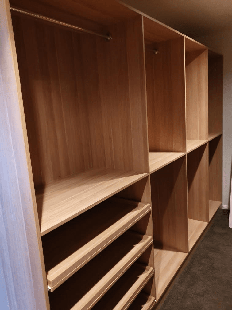 Full colour WIR with full colour backing using Polytec European Walnut Matt MR MDF. Raised lip drawer fronts & slide out shoe shelving