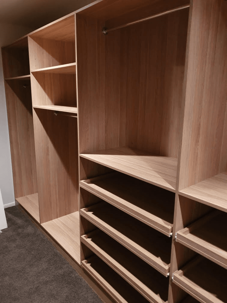 Full colour WIR with full colour backing using Polytec European Walnut Matt MR MDF. Raised lip drawer fronts & slide out shoe shelving