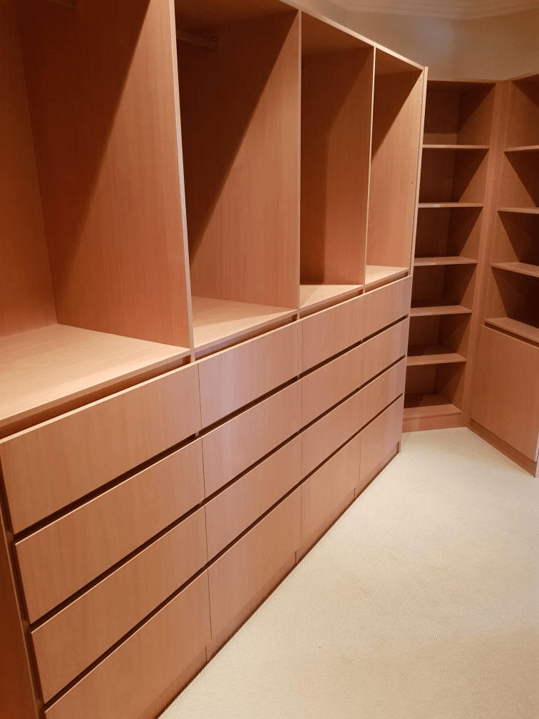 Full colour WIR using DR Henderson Sonova Beech. Full colour backing. Raised lip drawer fronts, tilt forward laundry hamper. Designer to suit angled wall for maximum storage