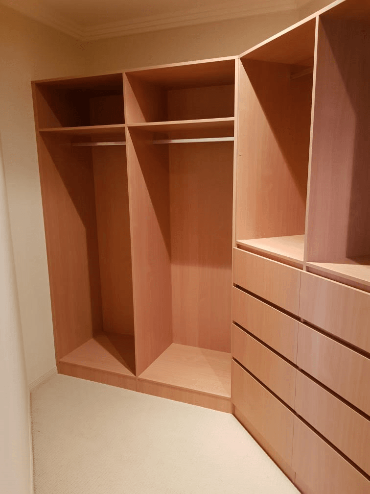 Full colour WIR using DR Henderson Sonova Beech. Full colour backing. Raised lip drawer fronts, tilt forward laundry hamper. Designer to suit angled wall for maximum storage