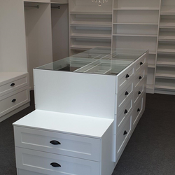 White WIR with shaker profile drawer fronts. Centre Island with seat & glass top. Sloping shoe racks with upstands and slide out scarf cupboard