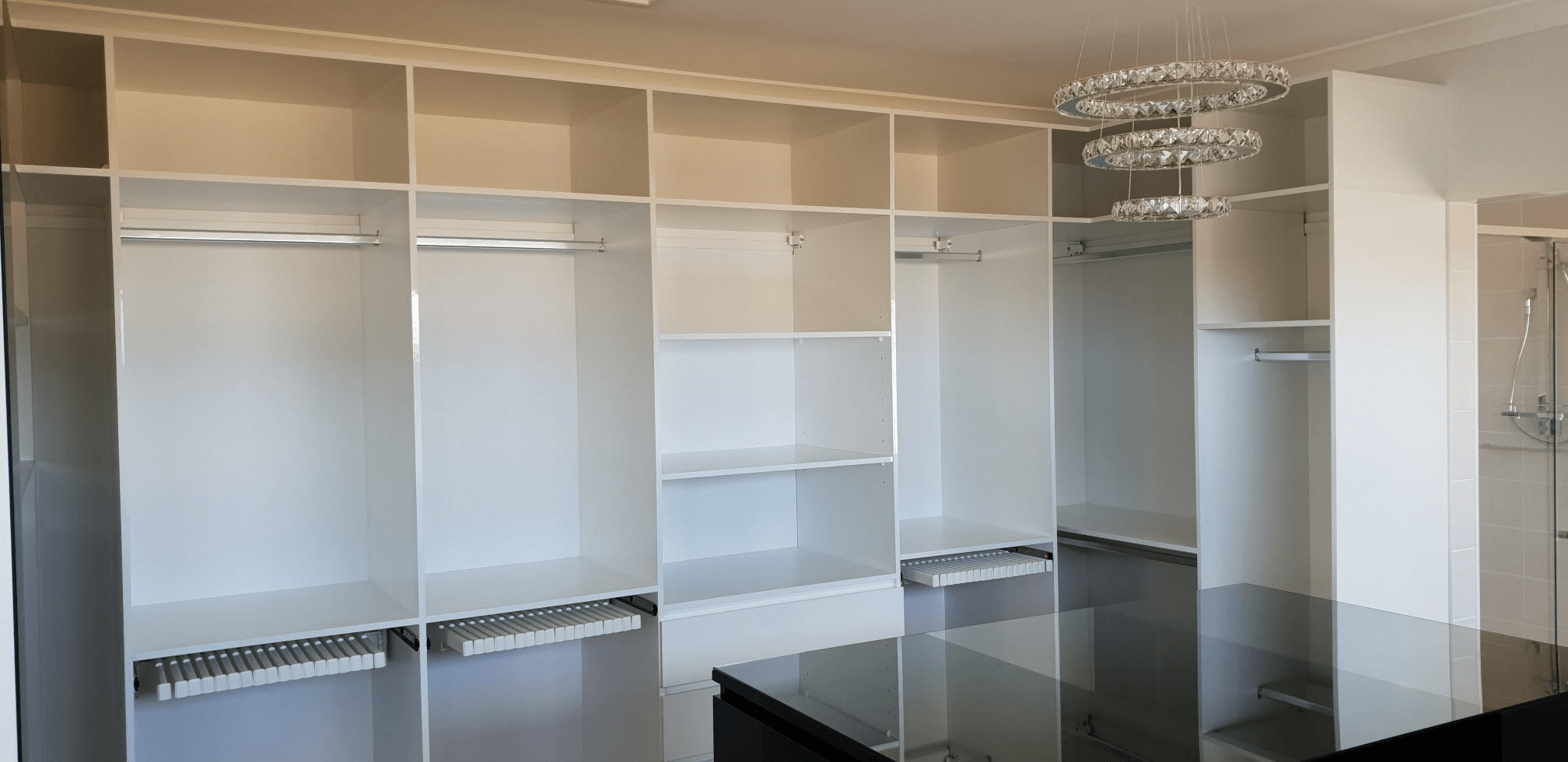 Polytec Polar White sheen and Black Createc WIR. Artia trouser racks and centre island