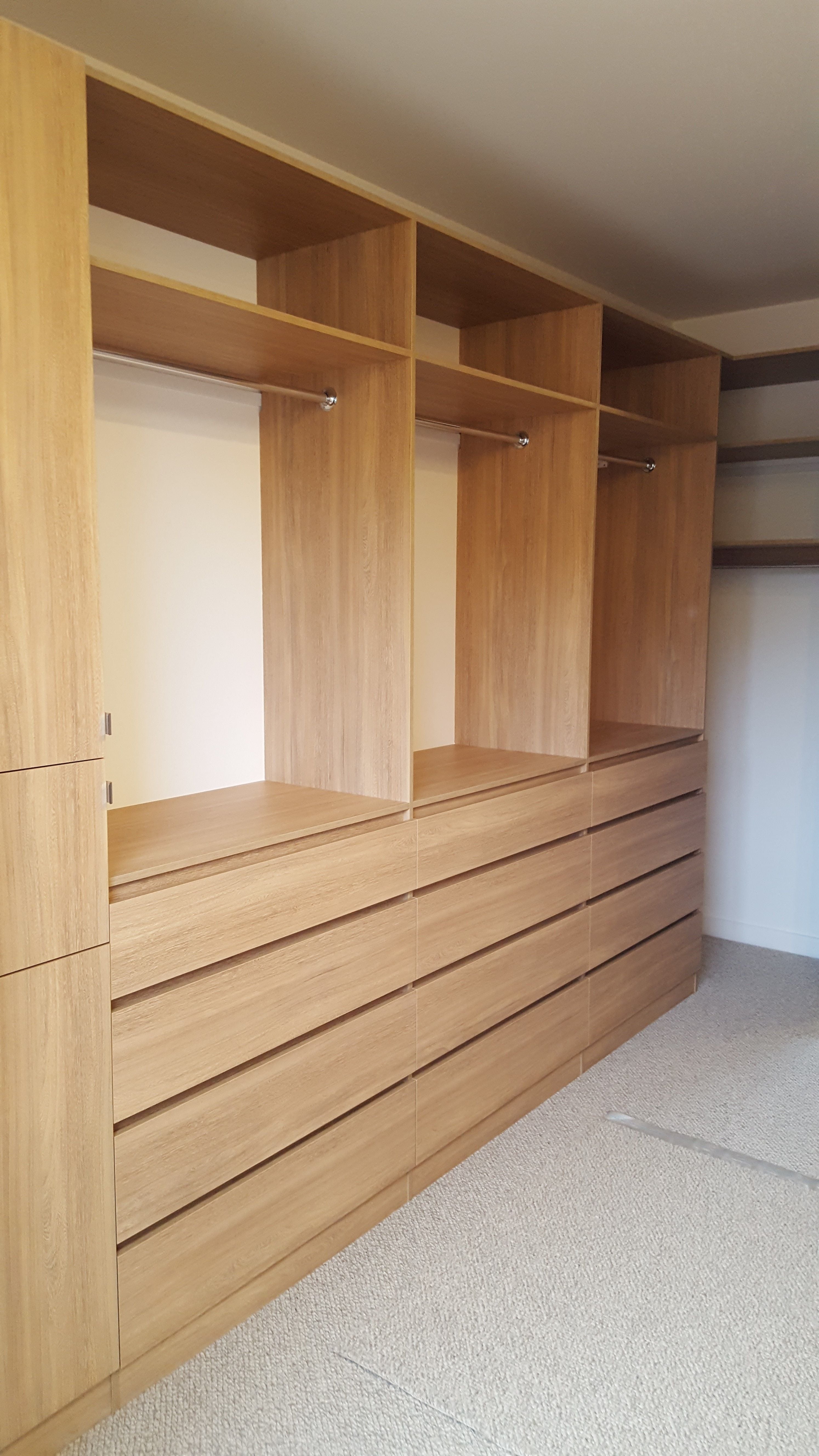 Laminex Elegant Oak WIR. Secondary top shelf. Raised lip drawer fronts. Tilt forward laundry hamper. Hinged mirror door