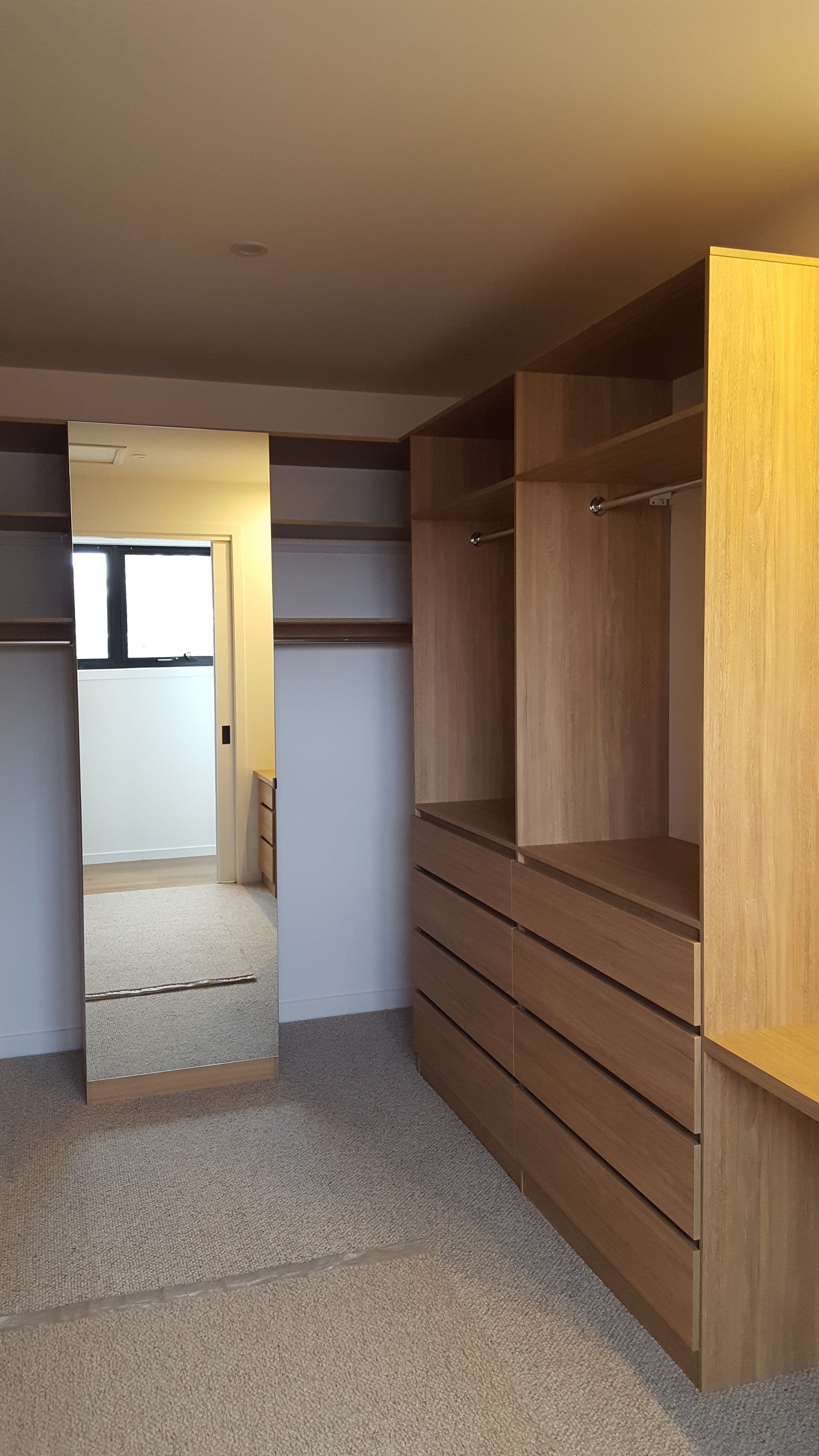 Laminex Elegant Oak WIR. Secondary top shelf. Raised lip drawer fronts. Tilt forward laundry hamper. Hinged mirror door