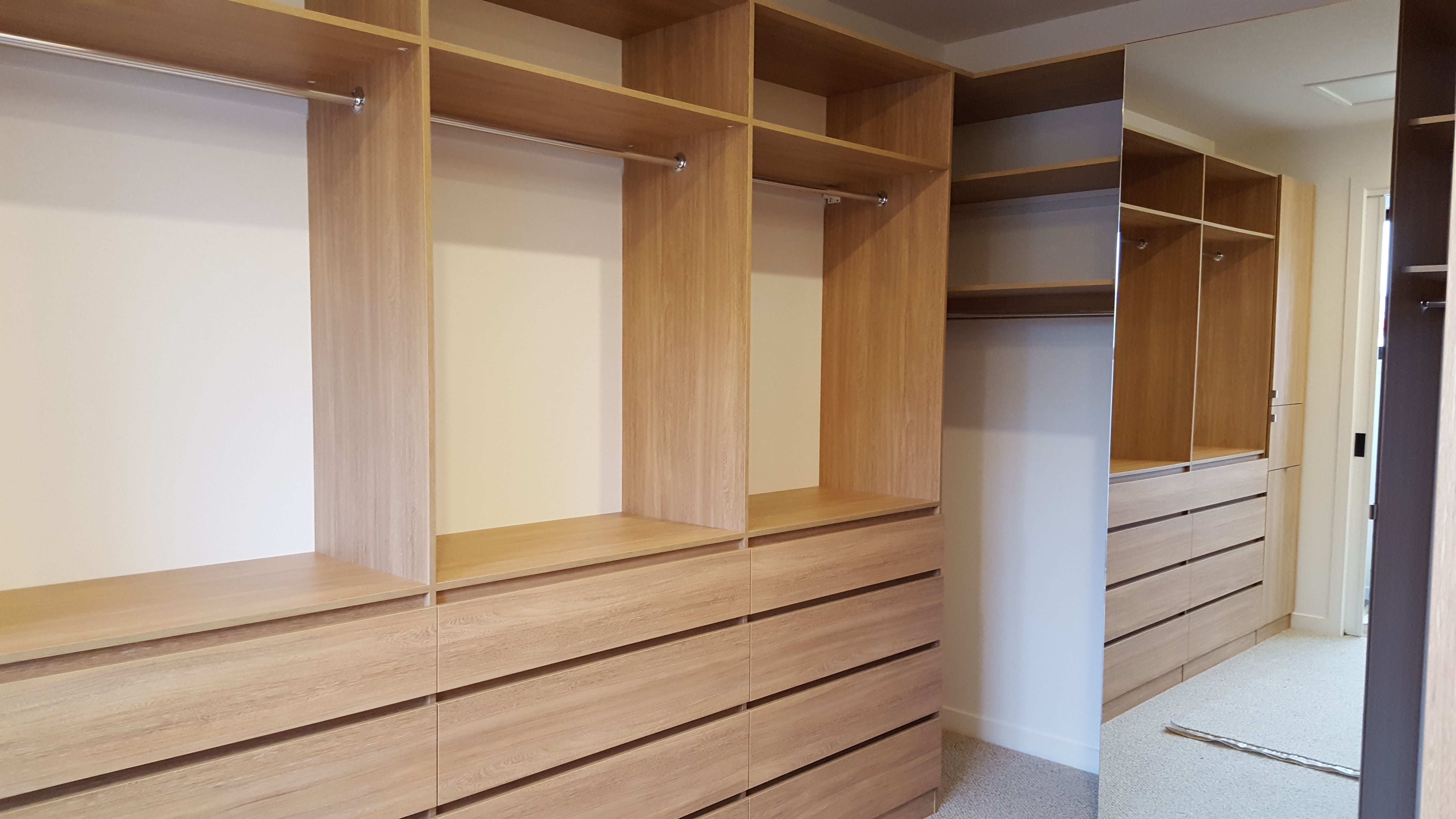 Laminex Elegant Oak WIR. Secondary top shelf. Raised lip drawer fronts. Tilt forward laundry hamper. Hinged mirror door