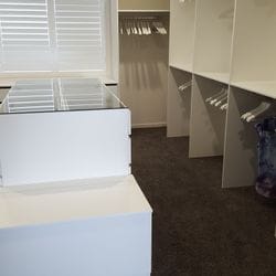 WIR using White HMR Melamine, centre island with 6mm toughened clear glass top. Blanket box seat. No backing. Open drawer fronts and white 32mm diameter hanging rail