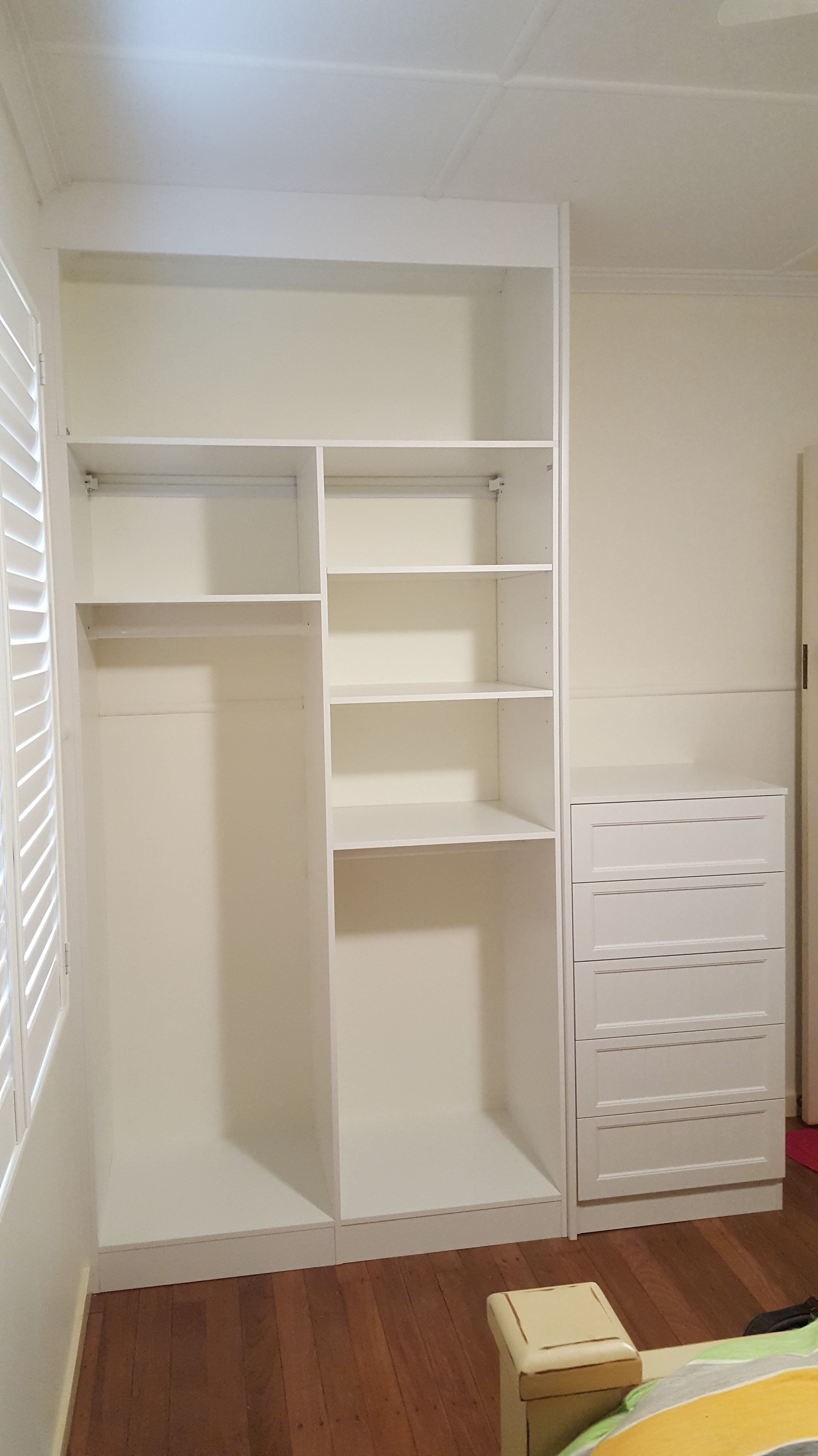 Built in robe using White HMR Melamine internals and 2 pack painted external drawer box with profile drawer fronts. bulkhead and end wall panel