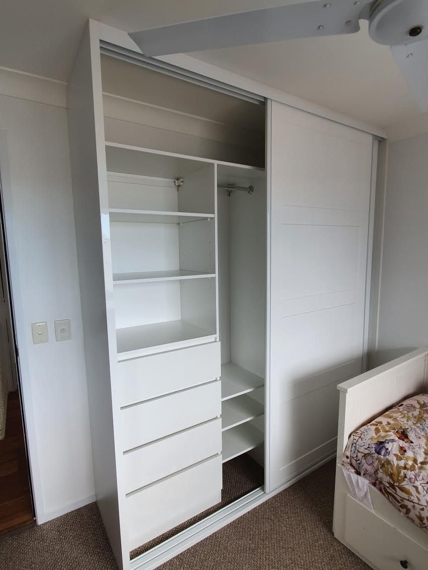 BIR using White HMR Melamine with raised lip drawer fronts and shelving