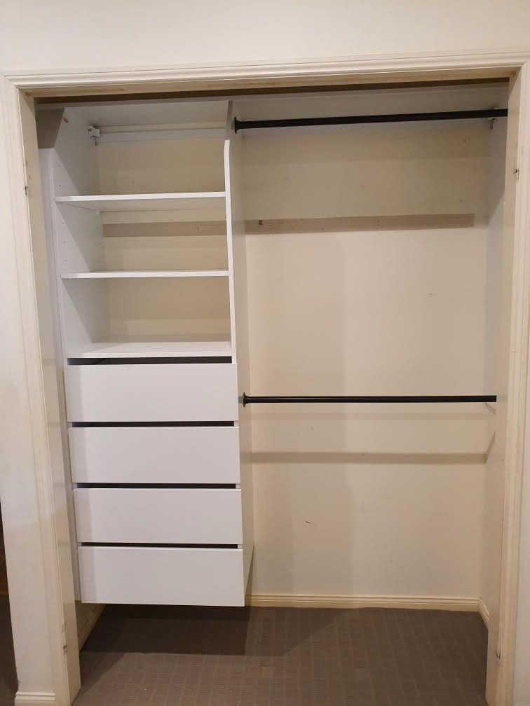 Suspended built in robe using White HMR Melamine with open drawer fronts, shelving and double hang using black hanging rail