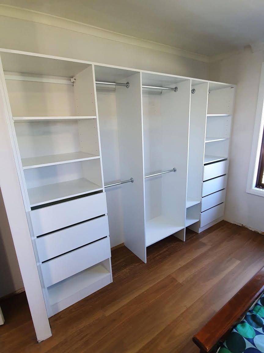 Built in robe using White HMR Melamine with open drawer fronts, shelving and double hang using chrome hanging rail