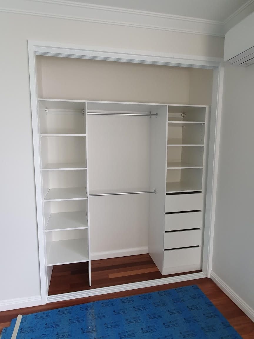 Built in robe using White HMR Melamine with open drawer fronts and shelving