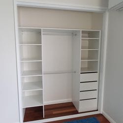 Built in robe using White HMR Melamine with open drawer fronts and shelving