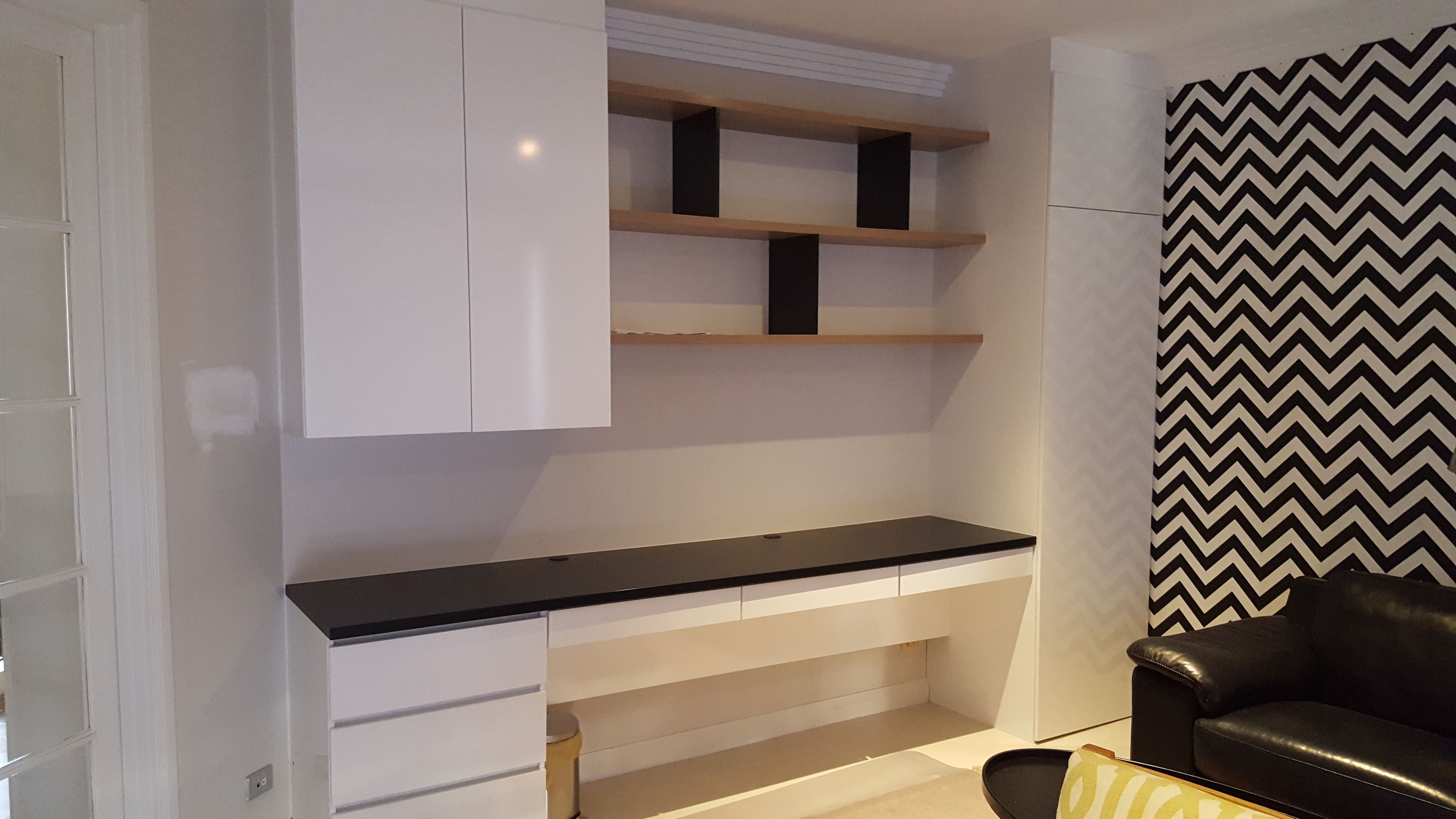 Study nook using Polyec "Polar White sheen", 33mm post form desk top in black matt. Shelving using 33mm Polytec "Maison Oak Ravine". All hinged doors with Blum push catch openers & hinges