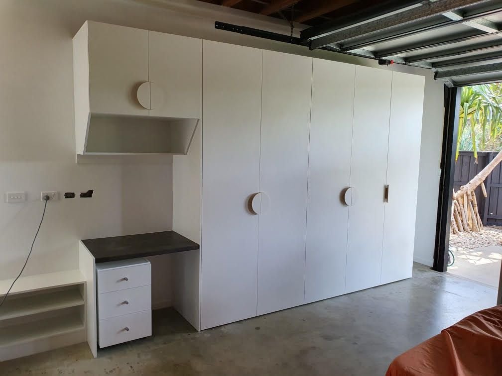 Garage storage to incorporate desk top, shoe shelving and mobile drawer box. White HMR Melamine.