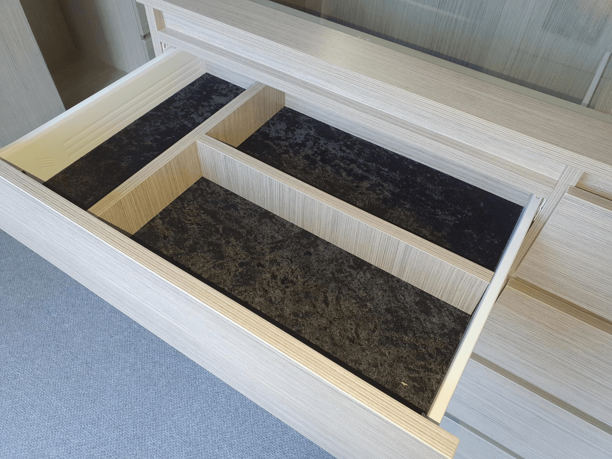 Black velour lined drawer with dividers