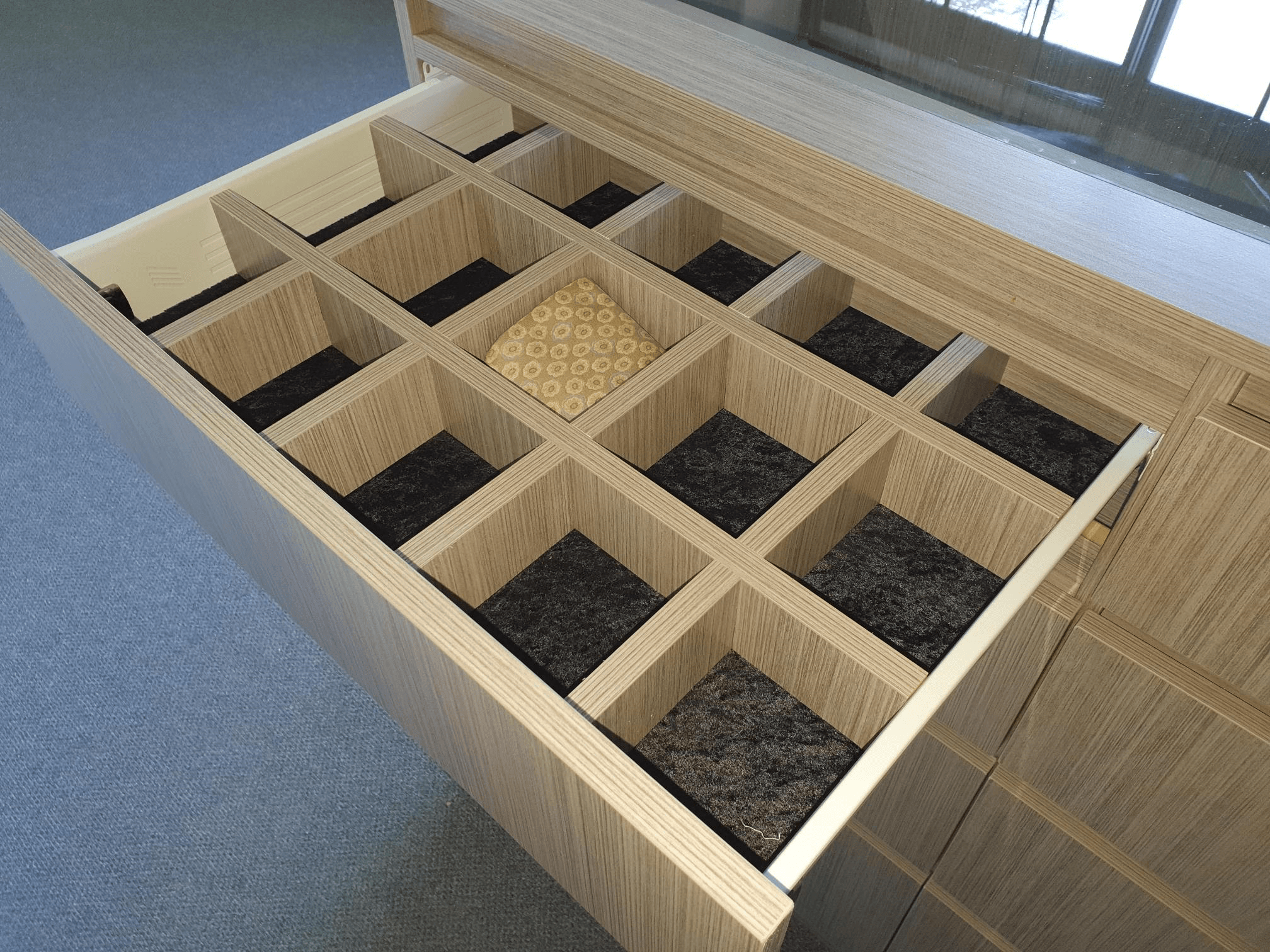 Black velour lined drawer with tie and belt dividers
