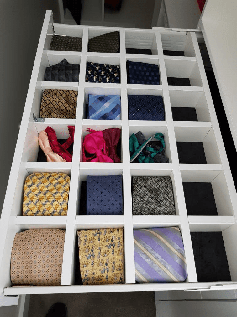 Black velour lined drawer with tie and belt dividers