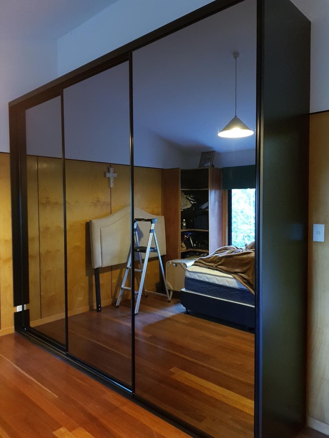 Fully framed 4mm vinyl backed dark grey mirror sliding doors. Dias Black aluminum trims & track