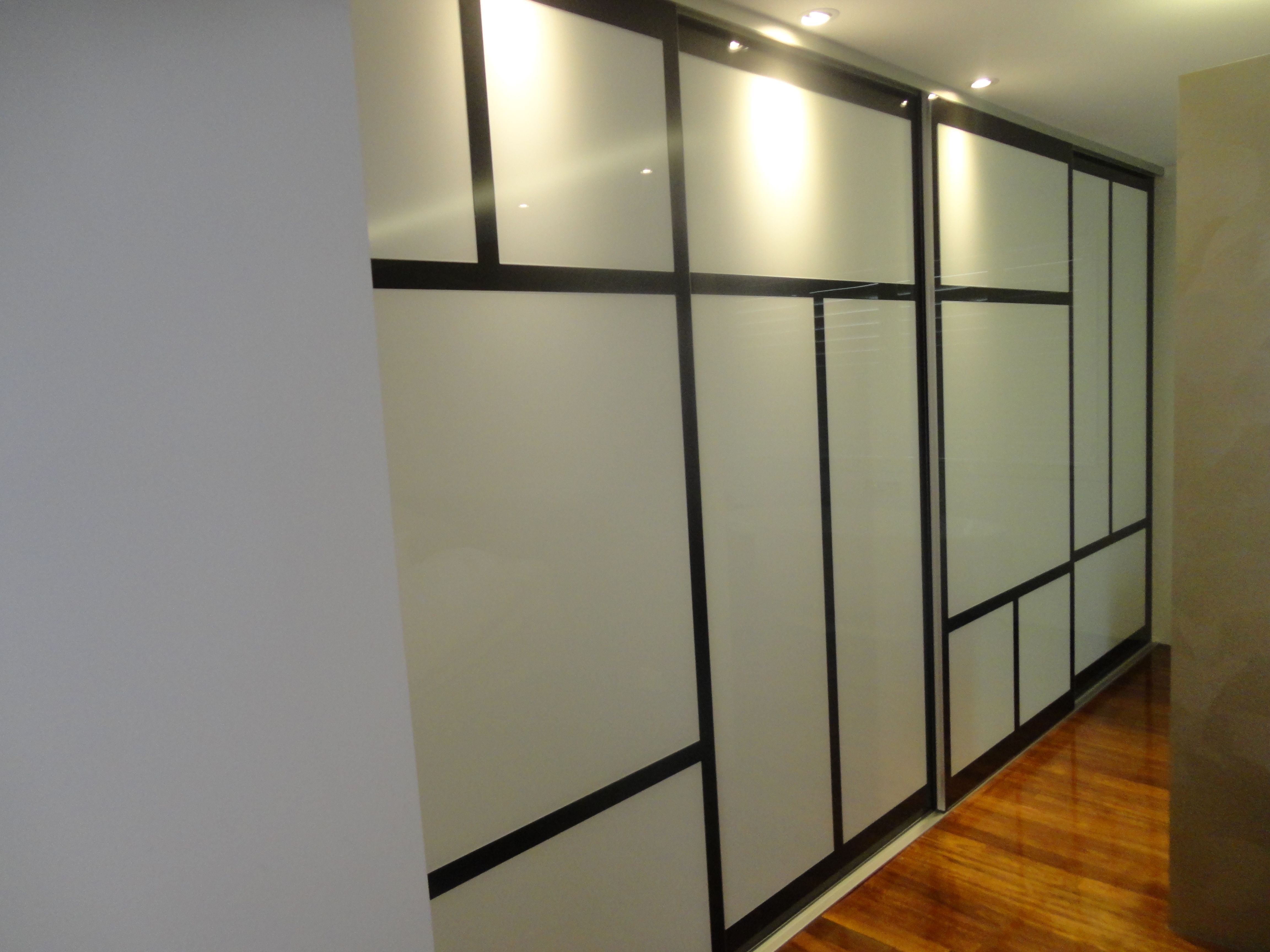 Frame Less sliding doors. Polytec "Black Wenge Matt" MR MDF border & opaque white glass inserts. Dias Satin silver top & bottom tracks & 2mm trims