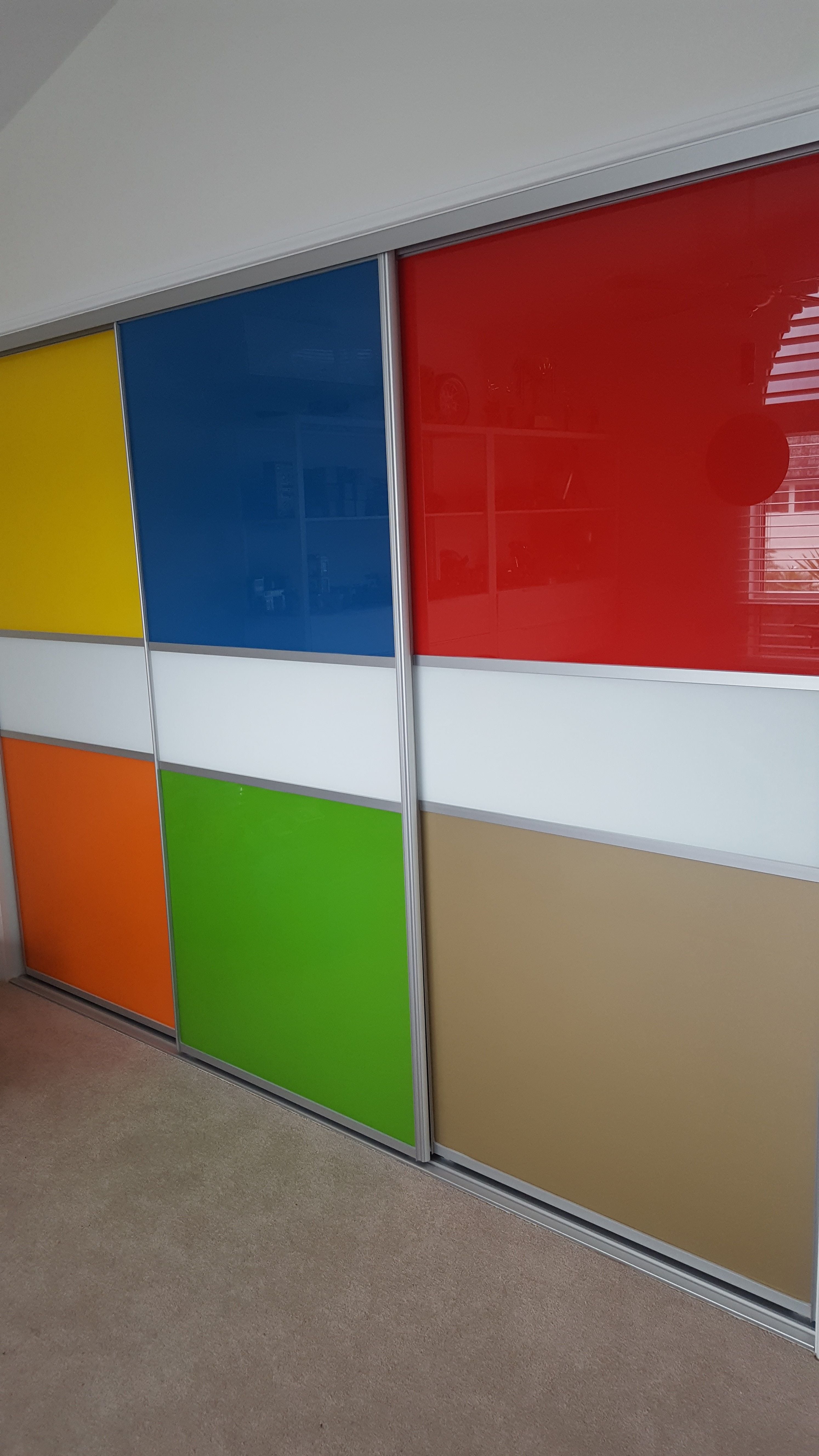 1 set of 3 fully framed divider sliding doors. Combination of 6mm painted glass insets. Dias Satin silver trims & tracks