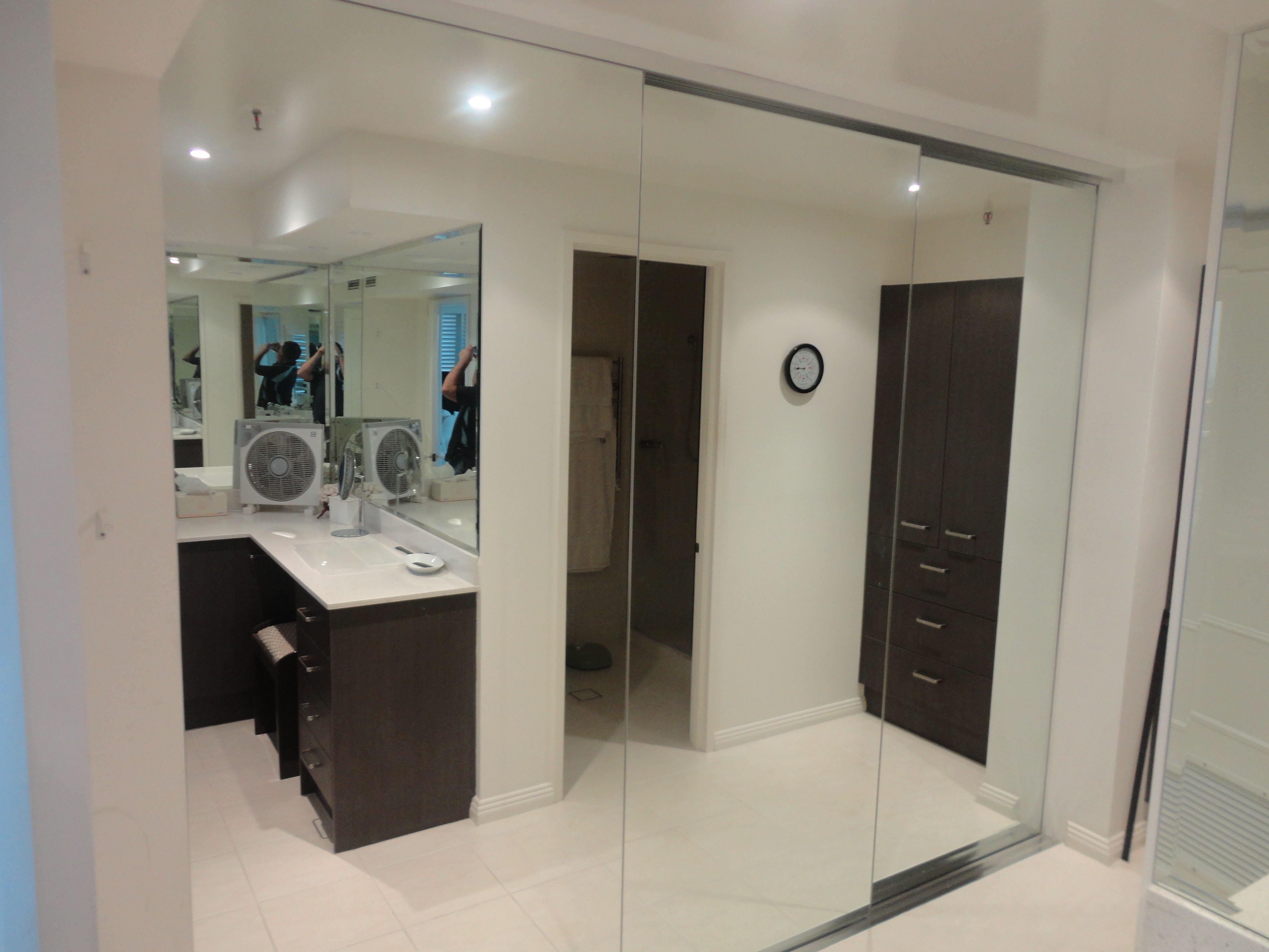 1 set of 3 frame less 4mm vinyl backed mirror sliding doors. Dias satin silver tracks & 2mm trims