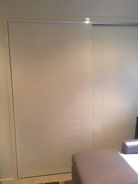 1 set of 2 frame less "Downey" profile panel sliding doors. 2 pack painted finish. Dias Satin silver 2mm trims & tracks