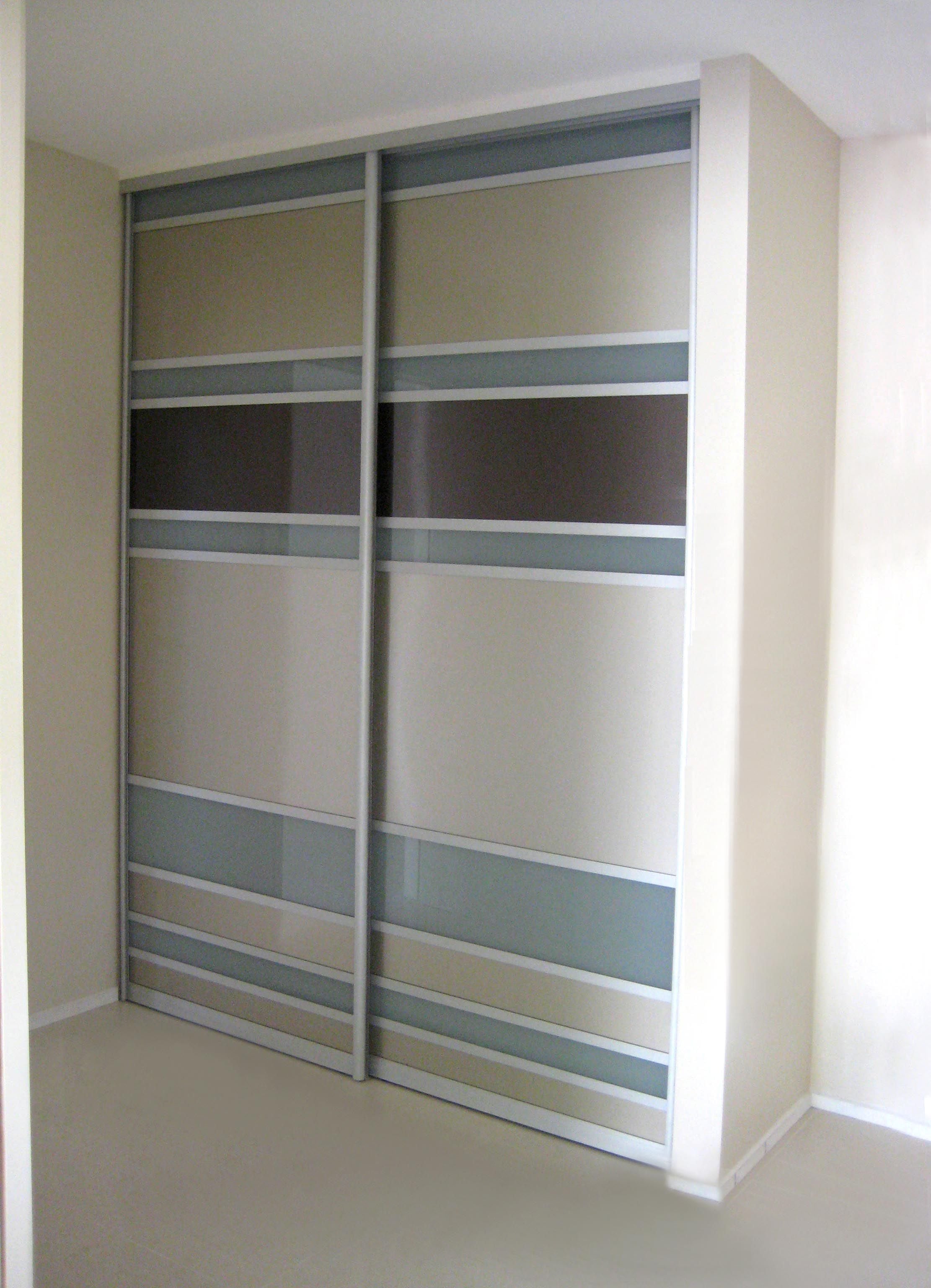 1 set of 2 fully framed divider sliding doors. Combination of painted glass and translucent glass inserts. Satin silver aluminum trims & tracks