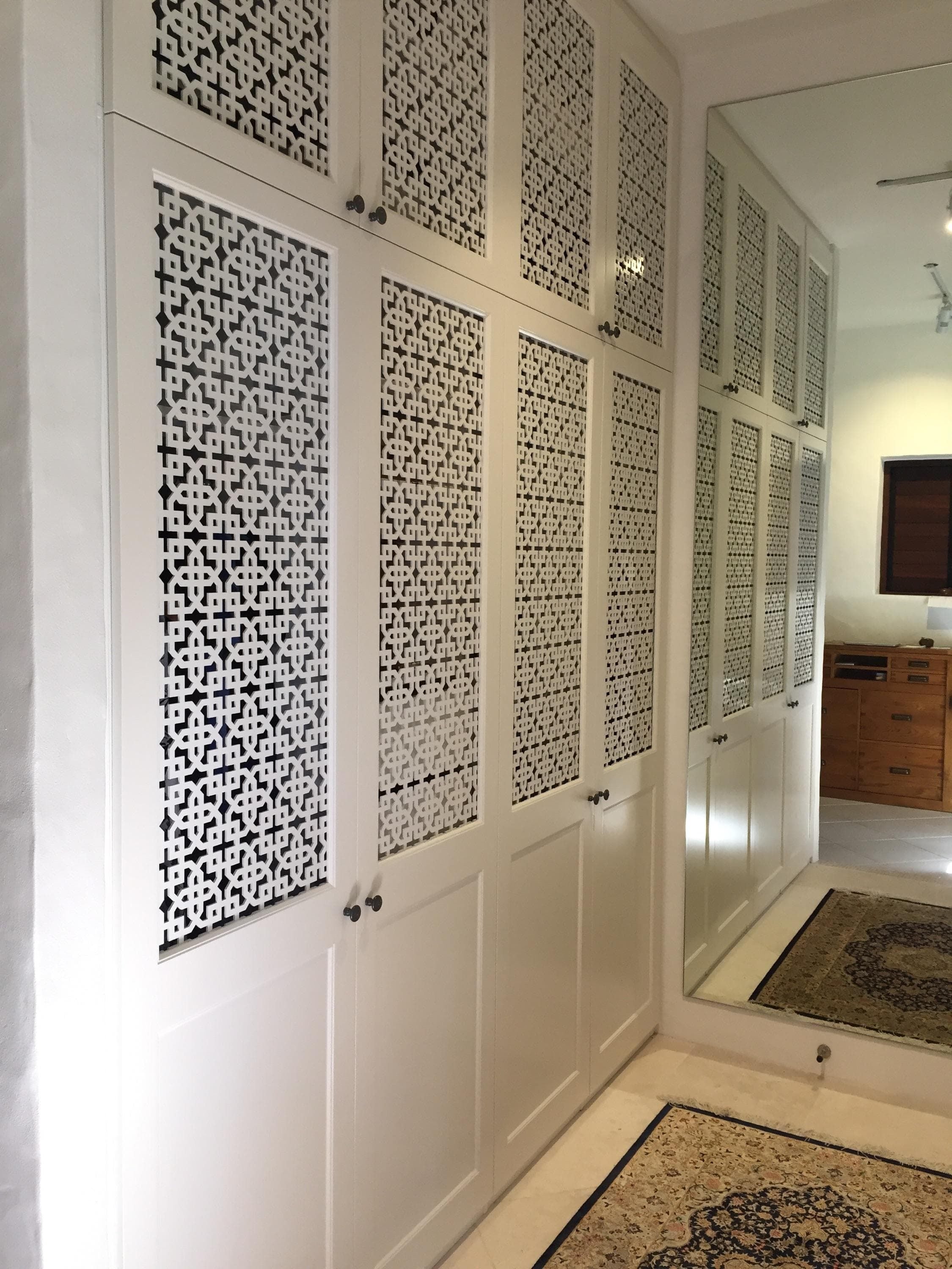 Hinged doors with 2 pack painted finish. Profile bottom panel and powder coated decorative screen inserts