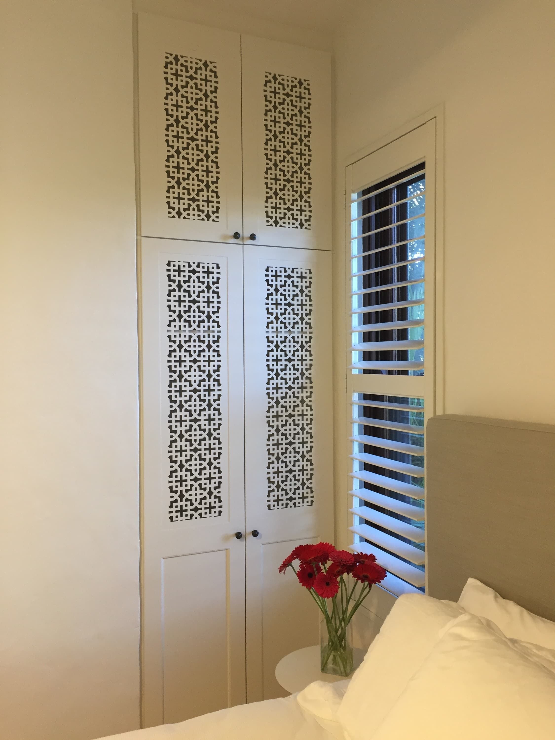 Hinged doors with 2 pack painted finish. Profile bottom panel and powder coated decorative screen inserts. Overhead hinged doors & bulkhead