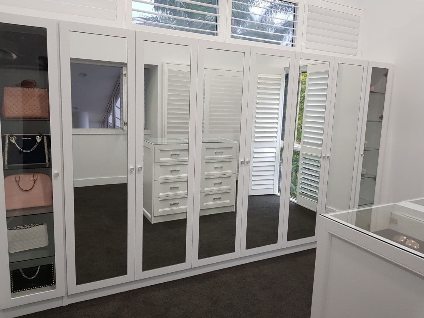 6 hinged doors with mirror insert. 2 hinged doors with 6mm toughened clear glass inserts. 100mm border with 2 pack painted finish. "Kethy" diamanté knobs
