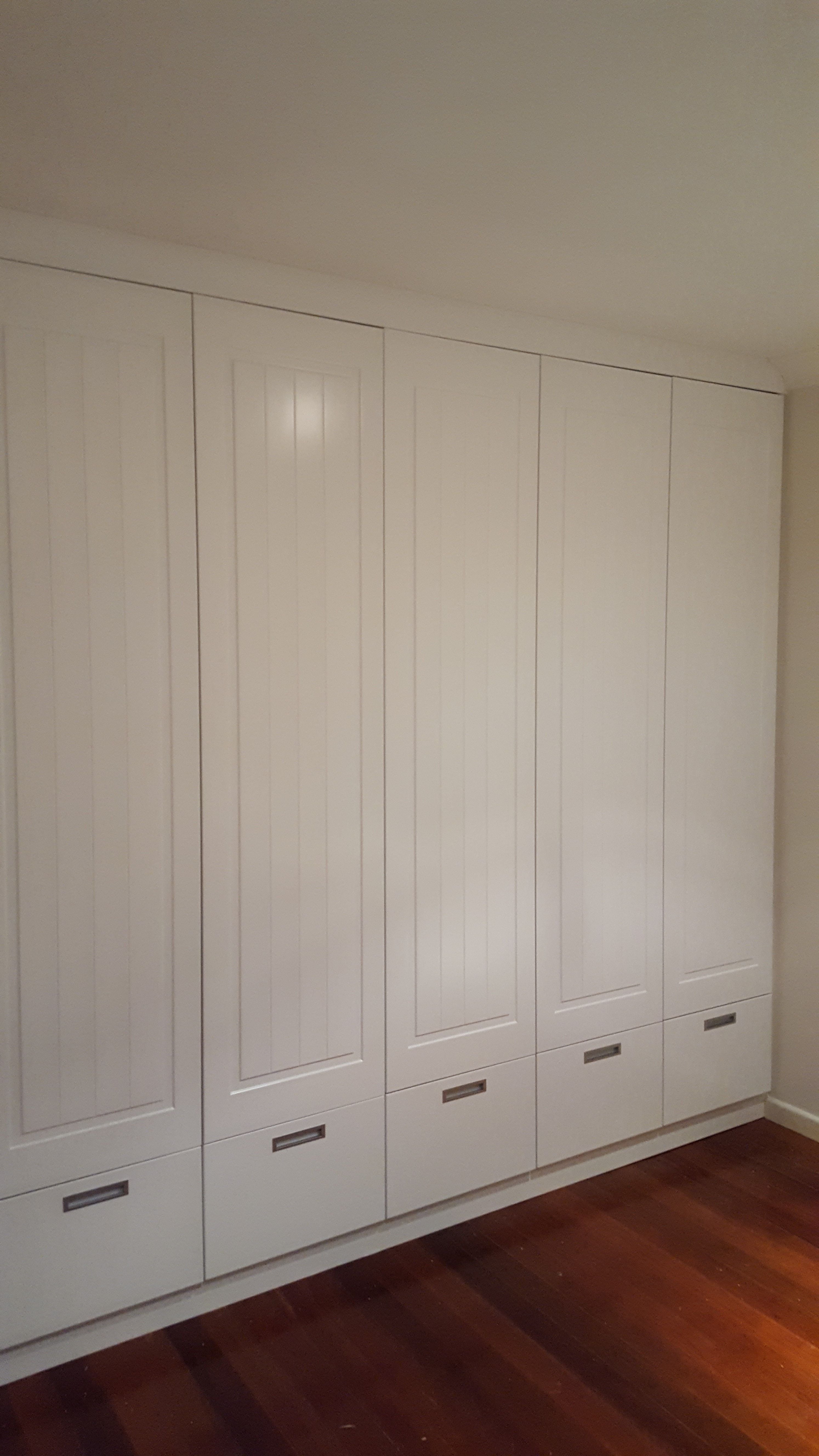 Profile 1 with VJ insert hinged doors with suspended file drawers underneath. Satin silver recessed handles. 2 pack painted finish