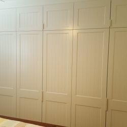 6 sets of 2 hinged doors with Profile 2 VJ panels and 2 pack painted finish. White 100mm finger pull handles