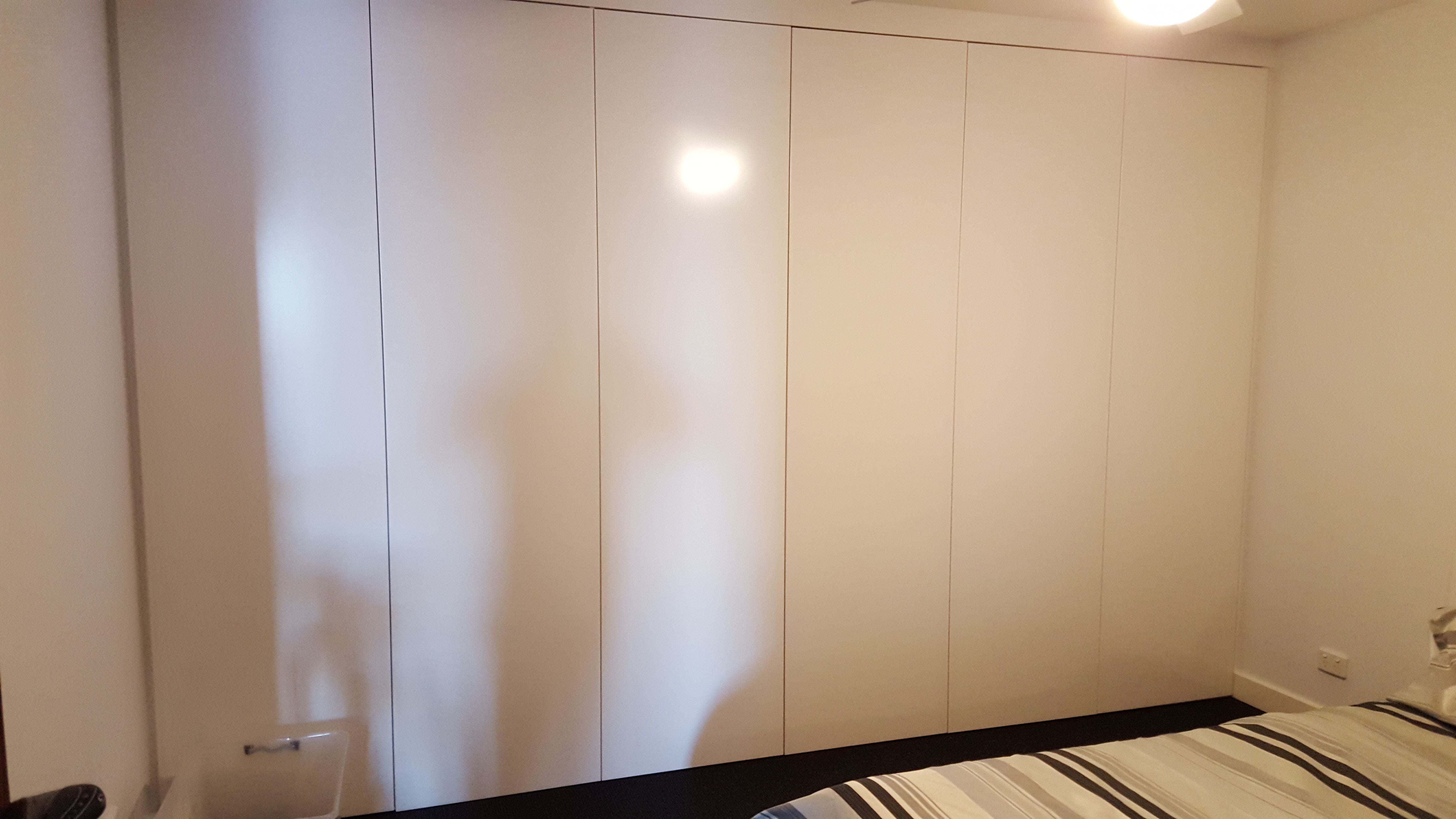 3 sets of 2 flat hinged doors with 2 pack painted finish and Blum push catch openers
