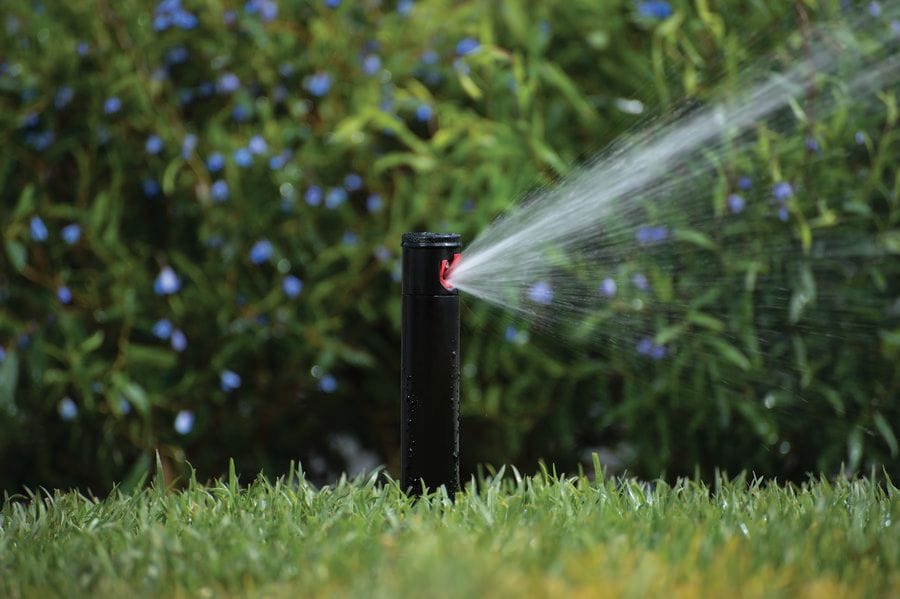 Hunter PGJ sprinkler spraying water on lawn