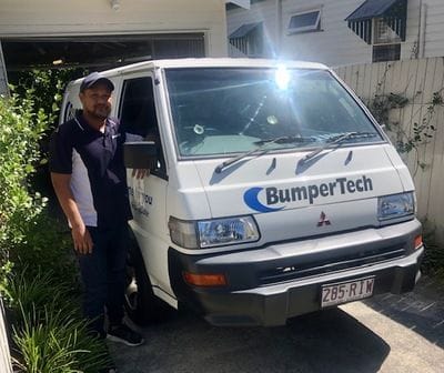 Bumpertech technician entering their own mobile repair van