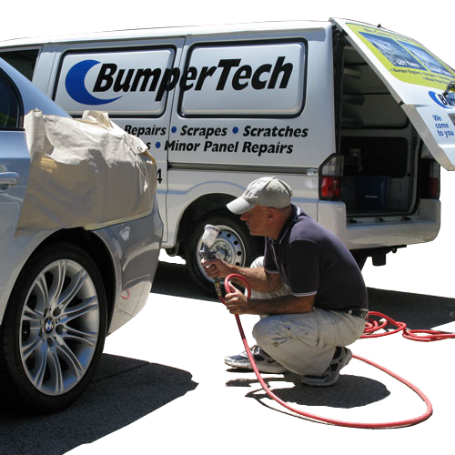 Bumper repair specialist in Gold Coast repairing a car bumper from their mobile bumper repair van