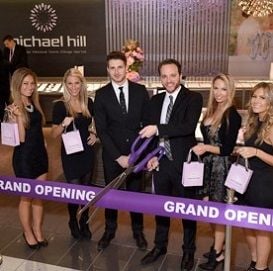 MICHAEL HILL TAKES A BITE OUT OF BIG APPLE