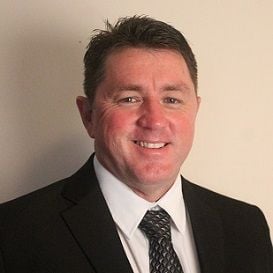 SWAPPING THE TOOL BELT FOR A SUIT AND TIE